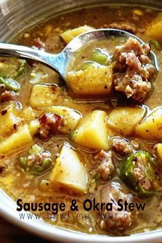 a bowl of sausage and potato stew with a spoon