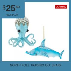 an ornament that is blue and has an octopus on it with pearls in its mouth