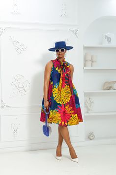 Elevate your style with the Florence African Print Loose Fit Sleeveless Dress. This vibrant and colorful dress offers a loose fit, allowing for maximum comfort and movement. Made with high-quality African print fabric, it brings a touch of cultural heritage to your wardrobe. Perfect for any occasion, this dress is both stylish and comfortable. FEATURES.* 100% African Wax Cotton* Neck tie design with back zipper*Dress is UnLined * Model Is Wearing A Size S/MCARE INSTRUCTION* Hand Wash in Cold Wat Loose Dress Outfit African Print, Sleeveless African Print Dress, Maternity Outfits African Prints, Multicolor Printed Ankara Maxi Dress, Vibrant Print Cotton V-neck Dress, African Wear Dresses, African Print Fabric, Dress Zipper, African Print Dresses