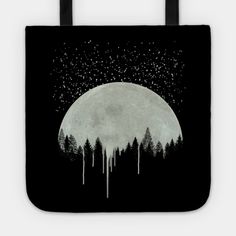 a black and white tote bag with trees in the foreground, stars above it