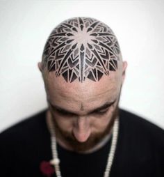 a man with a tattoo on his head