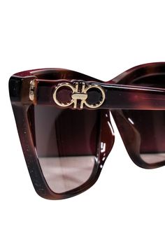 Take your look to the next level with these fashionable Ferragamo sunglasses! With their stylish brown tortoise frames and slimmer design, they'll keep your look chic and vacation ready. Add some classic style to any wardrobe and make those sunny days even brighter. Made in Italy Brown acrylic Dark lenses Comes with case and box Total length 5.75" Lens length 2" Lens height 1.5" Brown Acetate Sunglasses With Gradient Lenses, Designer Brown Acetate Sunglasses, Designer Brown Sunglasses With Uv Protection, Designer Brown Cat Eye Sunglasses, Designer Brown Cat Eye Sunglasses With Tinted Lenses, Formal Brown Acetate Sunglasses, Formal Tortoiseshell Sunglasses With Uv Protection, Formal Tortoiseshell Sunglasses With Gradient Lenses, Designer Brown Cat Eye Sunglasses With Uv Protection