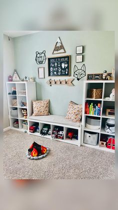 a child's playroom with toys and bookshelves on the floor in front of it