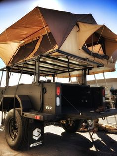 the back end of a truck with an awning on it