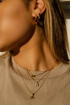 Find your peace anytime, anywhere with the Ohm Pendant. It's a unifying symbol that helps deepen the connection you have with yourself and the world around you—and acts as the cherry on top to your everyday style. Metal: 18k PVD gold plated over stainless steel Length: 16 inches in length + 2-inch extender (18 inches total) Lightweight Hypoallergenic Waterproof Tarnish-free Ohm Pendant, Find Your Peace, Waterproof Jewelry, Cherry On Top, Jewelry Plate, Everyday Style, Everyday Fashion, Gold Plate, Cherry