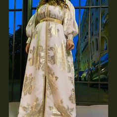 Elegant Gold Kaftan For Diwali, Wedding Kaftan With Zari Work, White Transitional Wedding Gown, Elegant Dabka Gown For Eid, Formal Dabka Gown For Eid, Elegant Festive Gown With Dabka, Elegant Festive Gown With Dabka Detailing, Elegant Dabka Gown For Festive Occasions, Elegant Kaftan With Dabka For Diwali