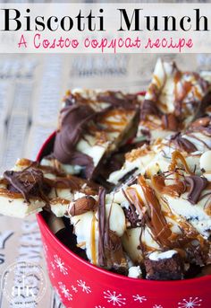 a red bowl filled with chocolate and marshmallows on top of a table