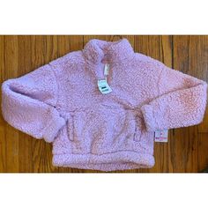 This Sherpa Midriff Hoodie Is Perfect For Your Little Girl! It Comes In A Beautiful Pink Color And Has Convenient Pockets. The Hoodie Is Made With High-Quality Materials To Ensure Durability And Comfort. The Size Is 10 And It Is Suitable For Girls. The Hoodie Is Great For Casual Wear And Is Perfect For Colder Days. It Features A Sherpa Brand Logo And Is Designed To Be Stylish And Comfortable. Purchase This Hoodie Today And Make Your Little Girl Feel Warm And Fashionable! Super Fast Shipping Pink Fleece Top For Winter, Pink Fleece Winter Top, Cute Winter Tops With Pockets, Winter Pink Fleece Top, Cozy Pink Fleece Tops, Cold Day, Hoodie Sweatshirt, Kids Shirts, Pink Color