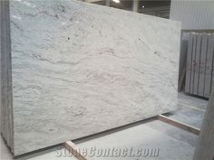 white marble is being displayed in a warehouse