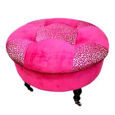 a pink ottoman with leopard print on it