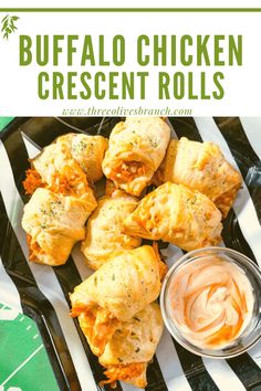 buffalo chicken crescent rolls on a black plate with dipping sauce in the middle and text overlay that reads buffalo chicken crescent rolls