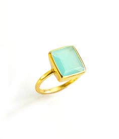 This beautiful bezel set ring is made with large rectangular faceted Aqua Chalcedony in 18K Vermeil Gold. The ring has a 925 stamp. Gemstone size is 9 x 14 mm. Please specify your size at checkout. Since I use natural gemstones, the stones may vary slightly in color, shape and size. Due to the nature of this stone there are natural inclusions and small internal fissures. This ring is available in two finishes: ✦ 18K VERMEIL GOLD ✦ 925 BRIGHT STERLING SILVER We have similar rings available with o Rectangular Faceted Ring As A Gift, Aqua Chalcedony Ring, Rectangle Ring, March Birthday Gifts, Gold Vermeil Jewelry, Chalcedony Ring, Bezel Set Ring, Gold Gemstone Ring, Aqua Chalcedony