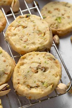 several cookies cooling on a rack with nuts