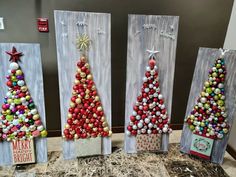 three canvass decorated with christmas trees and ornaments