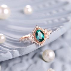 a ring with an oval blue topaz surrounded by pearls