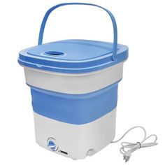 a blue and white cooler sitting on top of a white table next to a charger