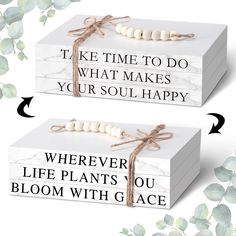 two white boxes with words on them and ribbons tied around the top one box is labeled,'take time to do what makes your soul happy wherever life plants you bloom with grace