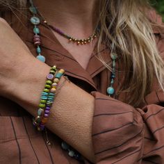 Yellow & purple composite beads with phosphosiderite, carnelian, turquoise Tuareg brass & ruby Elastic bracelet All natural stones, slight variations in color will occur Handmade in CT Riverstone Jewelry Dandelion Jewelry, Crystal Turquoise, Yellow Bracelet, Round Necklace, Czech Crystal, Elastic Bracelet, Yellow Purple, Mellow Yellow, 22k Gold