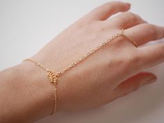 This Original Hand Jewelry is perfect for bridesmaid, wedding,... This Hand Bracelet is made with Gold plated differents chain, and Gold plated Lotus Flower.  ➵ Perfect to wear alone or for layering with more bracelets.➵ The bracelet length is ajustable thanks to 5 cm (2 in) extender chain.--*--*--*--*--*--*--*--*--*--*--*--*--*--*--*--*--*--*--∞ SIZE ∞- Bracelet length: Adjustable bracelet - around 15 cm (5.9 in) - 20 cm (7.9 in).If you like another length please make a note when you "check out Adjustable Simple Bangle Jewelry, Gold Bracelet Jewelry For Wedding, Gold Wedding Bracelet Jewelry, Adjustable Delicate Bracelet Jewelry, Delicate Adjustable Bracelet Jewelry, Delicate Adjustable Hand-set Jewelry, Wedding Bracelets With Adjustable Chain, Simple Gold Jewelry For Wedding, Adjustable Bangle Jewelry For Wedding