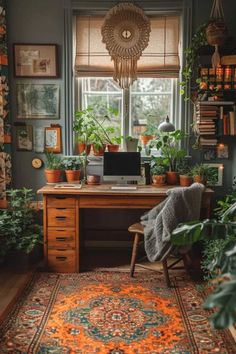 a home office with plants on the desk and a rug in front of the window