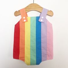 Baby retro rainbow romper. Poppers for easy changing, relaxed fit, plenty of room for nappies (cloth or disposable). Fully lined with light soft cotton. Seamless insides making them comfortable against babies skin. Rainbow design made up of carefully selected colours of 100% premium quality cotton. Adjustable length straps. Playful Cotton Jumpsuits And Rompers For Playtime, Multicolor Jumpsuits And Rompers For Spring Playtime, Spring Multicolor Cotton Onesie, Cotton Bubble Romper Overall For Playwear, Spring Multicolor Onesie For Playtime, Cute Multicolor Cotton Bubble Romper, Multicolor Cotton Onesie For Summer, Cute Multicolor Jumpsuits And Rompers For Playtime, Playful White Overalls For Summer