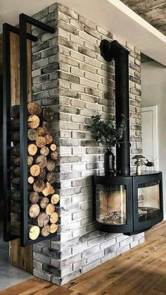 a fireplace with logs stacked on top of it