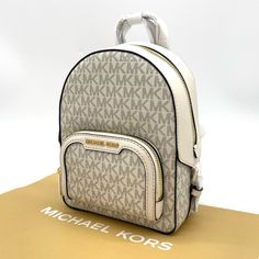 Brand New With Tag Michael Kors Jaycee Xs Mini Convertible Zip Pocket Backpack Crossbody Pvc Leather Mk Signature Color: Light Cream Multi Gold Tone Hardware Michael Kors Logo On Front 1 Zip Pocket At Front Zip Top Closure Custom Fabric Lining 2 Slip-In Pockets 7" (L) X 9' (H) X 3' (D) 2" Top Handle & Adjustable Backpack Straps White Logo Bags For Daily Use, White Bags With Logo For Daily Use, Cream Logo Bags For Travel, Classic White Bags With Logo, Luxury White Backpack For Errands, Classic White Backpack, Classic White Backpack For Travel, Classic White Travel Backpack, Classic White Backpack With Adjustable Strap