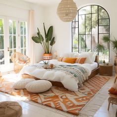 a large bed sitting inside of a bedroom on top of a white floor next to a window