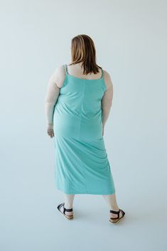 Unleash your inner cool with our MIDI LENGTH SLIP DRESS IN REEF! Made from the softest modal fabric, this ash grey dress features a V-neckline, adjustable cami straps, and side slits for ultimate comfort and style. Perfect for any occasion, it's time to make a statement and feel confident wherever you go! Fits slightly slim. We suggest going with your typical size. Stacey is wearing a size 3x. Want more information about the model? Visit our Lovely Models page. Wash Machine wash, gentle cycle in Casual V-neck Slip Dress For Sleep, Spring Loungewear Dress Made Of Modal, Spring Modal Loungewear Dress, Spring Loungewear Dress, Spring Modal Dress For Loungewear, Spring Lounging Dresses With Spaghetti Straps, Summer Lounging Dresses With Built-in Bra, Casual Seamless V-neck Dress, Summer Modal Dresses For Loungewear