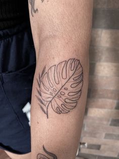 a person with a tattoo on their arm