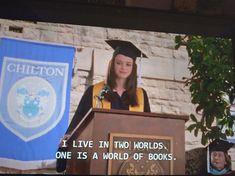 a woman standing at a podium in front of a large screen with the words i live in two worlds one is world of books