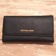 Nwt Michael Kors Black Saffiano Leather Large Jet Set Bifold Travel Wallet $278. Never Used. Measures Just Over 7in Long X 4in Tall X 3/4in Deep. Classic Saffiano Leather Travel Wallet, Designer Black Saffiano Leather Wallets, Elegant Saffiano Leather Business Wallet, Classic Black Saffiano Leather Wallet, Elegant Saffiano Leather Bifold Wallet, Rectangular Saffiano Leather Wallet, Travel Wallets With Gold-tone Hardware, Chic Travel Wallet With Gold-tone Hardware, Chic Formal Bags With Rfid Blocking