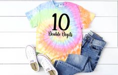 *CURRENT PROCESSING TIME: 3-6 business days before shipment* A NOTE REGARDING SIZING: These are basic unisex tie-dye shirts. Size down if you want a more fitted style.  This listing is for a tie dye colorful: 10 Double Digits Want a PROMO CODE?  Make sure to sign up for emails! Please visit here to subscribe: https://mailchi.mp/157ecc4dad66/aboutasprout *A note about our process: Shirts and infant bodysuits are not screen printed. No ink is used. I am happy to offer a more vibrant, longer lastin Shirts With Vinyl, Summer Tie Dye, Popular Shirt, Mama Tee, Tie Dye Shirts, Mom Life Shirt, Presents For Mom, Mama Sweatshirt, Tie Dye Shorts