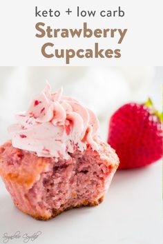 strawberry cupcakes with frosting and strawberries on the side