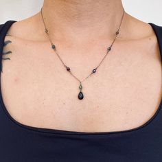 Fire polished Czech glass metallic beads accent this black onyx pendant necklace on a grey chain. Metallic beads in green, blue and purple shades. Making Beaded Necklaces, Elegant Necklace With Beaded Chain And Teardrop Pendant, Elegant Teardrop Pendant Necklace With Beaded Chain, Black Pendant Necklaces With Beaded Chain, Elegant Gunmetal Jewelry For Jewelry Making, Black Vintage Necklace, Silver Drop Necklaces With Faceted Beads, Dream Jewelry Necklaces, Gift Purple Necklace With Black Beads