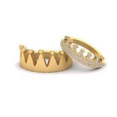 two gold rings with diamonds on them and one has a crown in the middle, while the