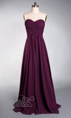 a strapless purple bridesmaid dress on a mannequin