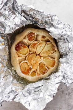 an apple pie sitting on top of aluminum foil