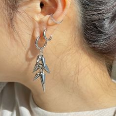 Add an edgy touch to your look with these grunge-inspired spiky punk dangly earrings. Handcrafted with care, these earrings feature a unique design that effortlessly blends attitude with style. Perfect for adding a pop of personality to any outfit, these earrings are sure to make a statement wherever you go. Embrace your inner rebel and stand out from the crowd with these one-of-a-kind accessories. ▪️▪️▪️PRODUCT Solid surgical steel  Never Fade, Tarnish Free and Hypoallergenic Sold by pair 2pcs 10mm Inner Diameter Hoops VISIT STORE FOR MORE PRODUCT 🔗 https://www.etsy.com/ca/shop/TWISTEEL ▪️▪️▪️ S H I P P I N G   All orders will be shipped on the next business day UNITED STATES  - USPS First-Class Mail * 4 - 14 Business Days  Tracking & Insurance included CANADA - Canada Post * 4 - 14 Busi Spiky Jewelry, Punk Earrings, Earrings Trendy, Titanium Jewelry, Spike Earrings, Nose Rings Hoop, Mismatched Earrings, Dangly Earrings, Earrings Statement