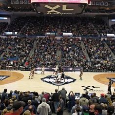 a basketball game is being played in an arena