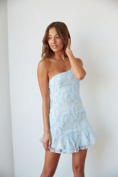 Hey babe, meet the baby blue dress of your dreams! The Livia One Shoulder Lace Ruffle Mini Dress is the perfect summer party dress. Featuring an asymmetrical neckline with an adjustable spaghetti strap, ruffle hem, and subtle white polka dots. Complete the fab look with the Ukari Clear Block Heel. Details 100% Polyester Fully lined Hidden back zip closure Material has minimal stretch Hand wash / Hang dry Sizing & Fit Fits true to size Model is 5'9 wearing a size small Model Measurements: Bust 34 Baby Blue Dress Short Formal, Sorority Formal Dresses Short, Hoco Dresses Ruffle, Trendy Hoco Dresses 2024, Blue Recruitment Dresses, Blue And White Mini Dress, Ruffle Hoco Dress, Homecoming Short Dresses, Sorority Recruitment Dresses