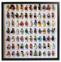 lego minifigures are displayed in a shadow box on a white wall with black trim