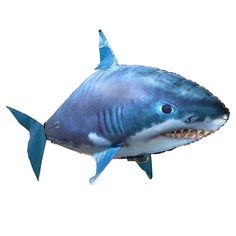 a blue shark balloon floating in the air