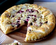 a close up of a pie on a wooden plate