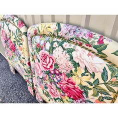 two floral couches sitting next to each other