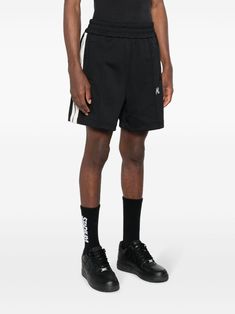 Bermuda shorts with PALM ANGELS logo in black, characterized by elasticated waist, front logo, two side pockets. This item is in size M and the color is Streetwear Shorts With Logo Waistband, Relaxed Fit Bottoms With Logo Waistband For Streetwear, Casual Streetwear Bottoms With Logo Waistband, Cotton Athleisure Shorts With Three Stripes Branding, Sporty Shorts With Logo Waistband For Streetwear, Relaxed Fit Sports Bottoms With Logo Waistband, Casual Streetwear Shorts With Logo Waistband, Black Casual Shorts With Logo Waistband, Casual Shorts With Logo Waistband For Streetwear