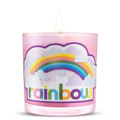 a pink candle with the word trainbow on it and a rainbow in the middle