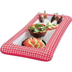 an inflatable tray with food and drinks on it