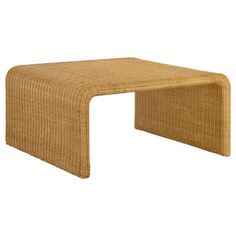 a small table made out of wicker with an extended end section on the top