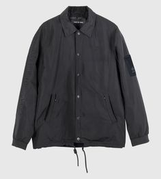 The supremely classic silhouette of the coach’s jacket, loaded with up to the times functionality and essential details; elastic bands at the cuffs can be turned out to reveal a reflective stripe, with matching reflective bands inside the 2 external pockets. Magnetic collar points cut the perfect lapel-line. Coat Of Ar Urban Windbreaker With Padded Collar For Streetwear, Streetwear Windbreaker With Padded Collar, Casual Long Sleeve Outerwear With Reflective Logo, Winter Streetwear Outerwear With Reflective Logo, Winter Windbreaker With Reflective Logo For Streetwear, Winter Streetwear Windbreaker With Reflective Logo, Casual Winter Outerwear With Reflective Logo, Classic Windbreaker With Pockets For Streetwear, Classic Streetwear Windbreaker With Pockets